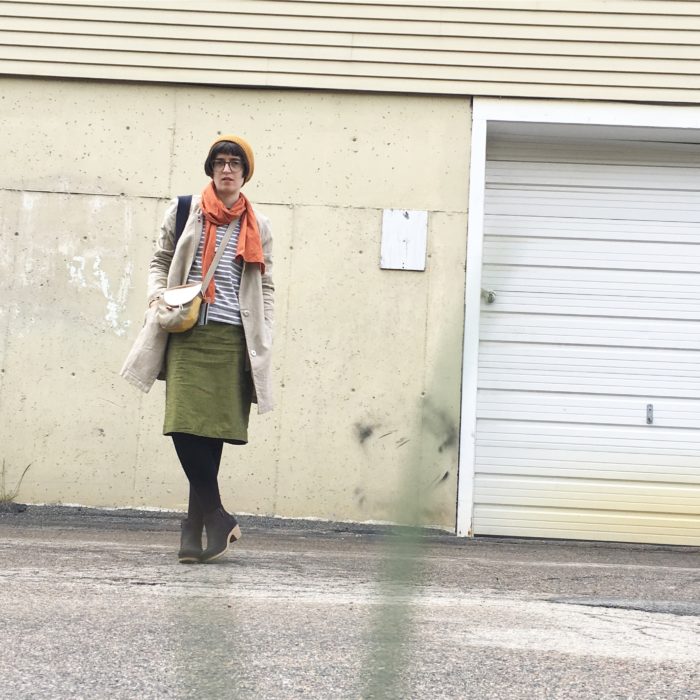 Woman standing in front of wall
