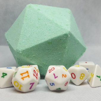 A large 10 sided dice made of soap in light green with a set of colorful dice around it