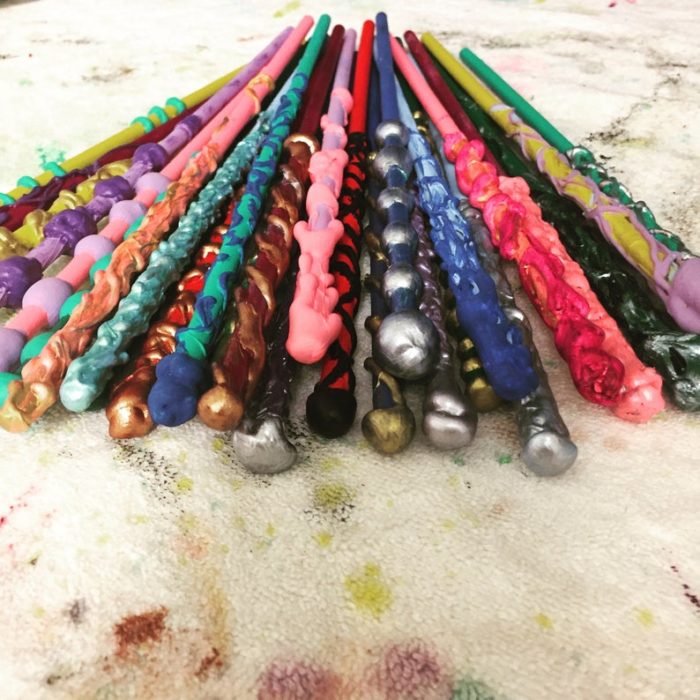 A stack of colorful wands inspired by Harry Potter