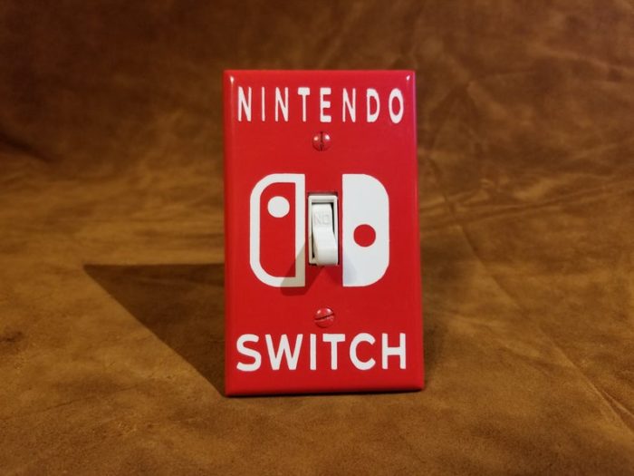 A red light switch plate that says "Nintendo Switch"